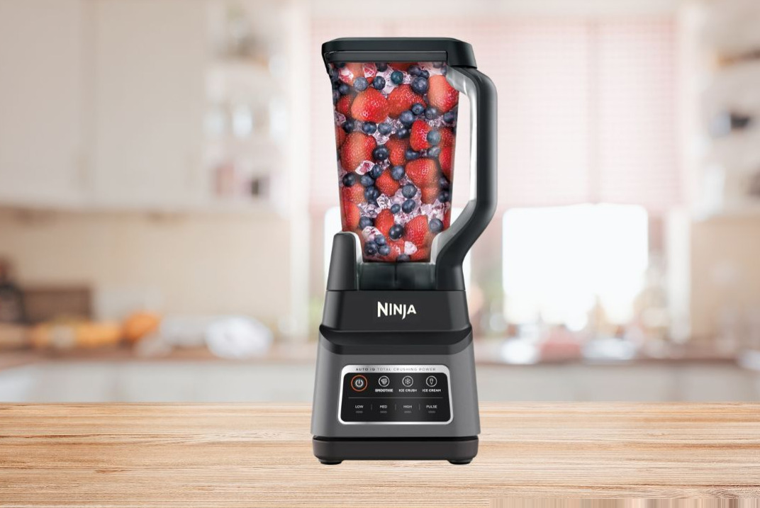 Ninja BN701 Professional Plus 1400W blender with 72oz pitcher and personal cups on kitchen counter